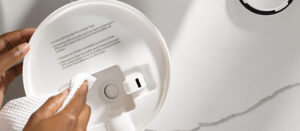 a person showing how to clean a humidifier from Honeywell